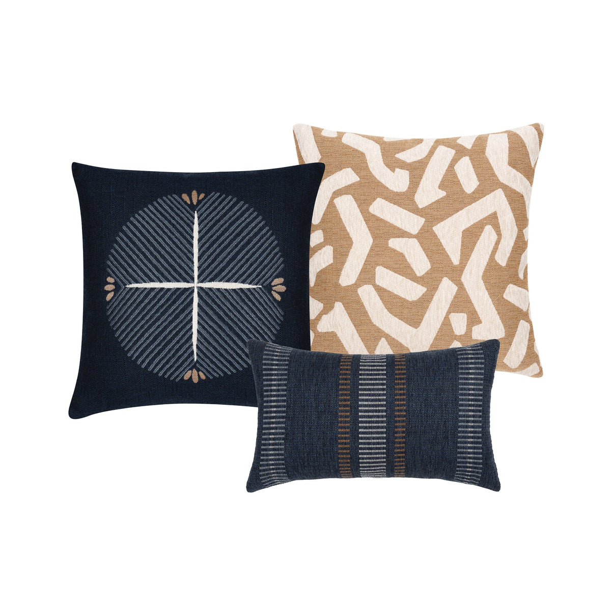 Three decorative throw pillows displayed against a solid white background: a square navy blue pillow with a cream geometric cross design, a square tan and cream pillow with an abstract maze pattern, and a rectangular navy blue lumbar pillow with vertical textured stripes.